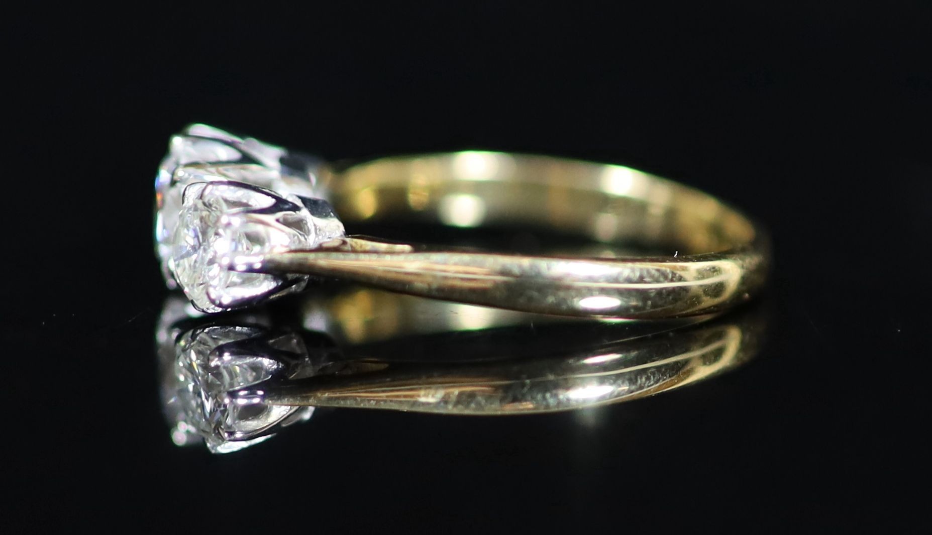 A 18ct gold and platinum, three stone diamond ring